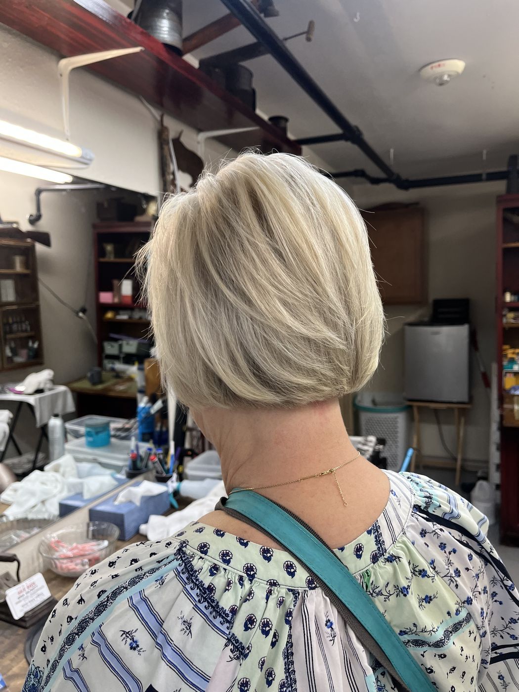 Short blonde bob with soft layers, styled at Hair Barn